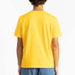 picture of a man wearing a Sun Yellow tee shirt with manana branding and blue shorts