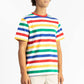 a man wearing a multi color tee shirt with big stripes and yellow shorts