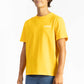 picture of a man wearing a Sun Yellow tee shirt with manana branding and blue shorts