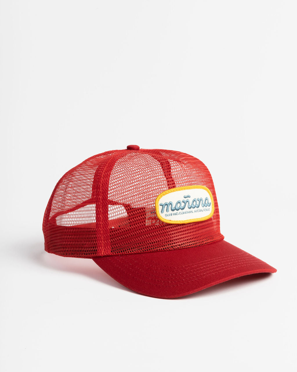 a picture of red mesh hat with Manana written on it