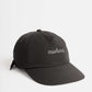 Black travel hat having Manana branding