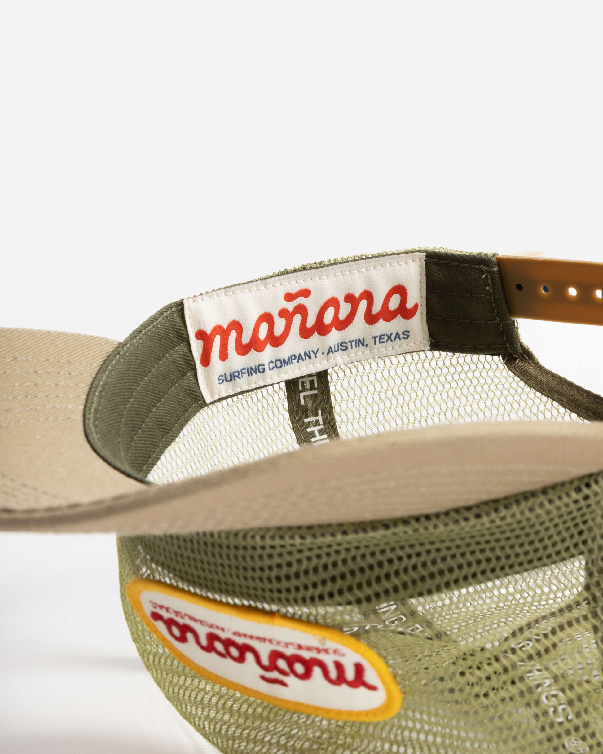 a picture of mesh hat with Manana written on it