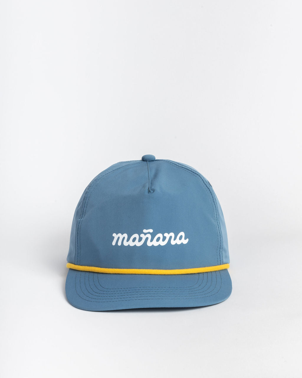 a blue classis cap with Manana branding