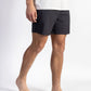 A man wearing a Black walk short underwear with white shirt