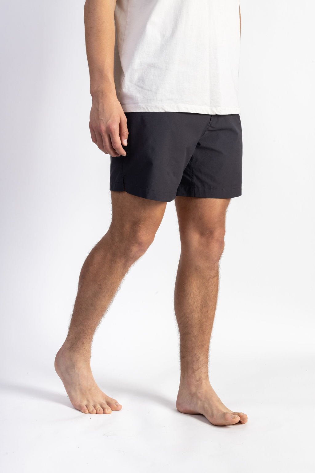 A man wearing a Black walk short underwear with white shirt