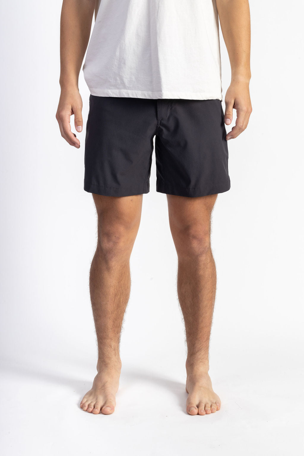 A man wearing a Black walk short underwear with white shirt
